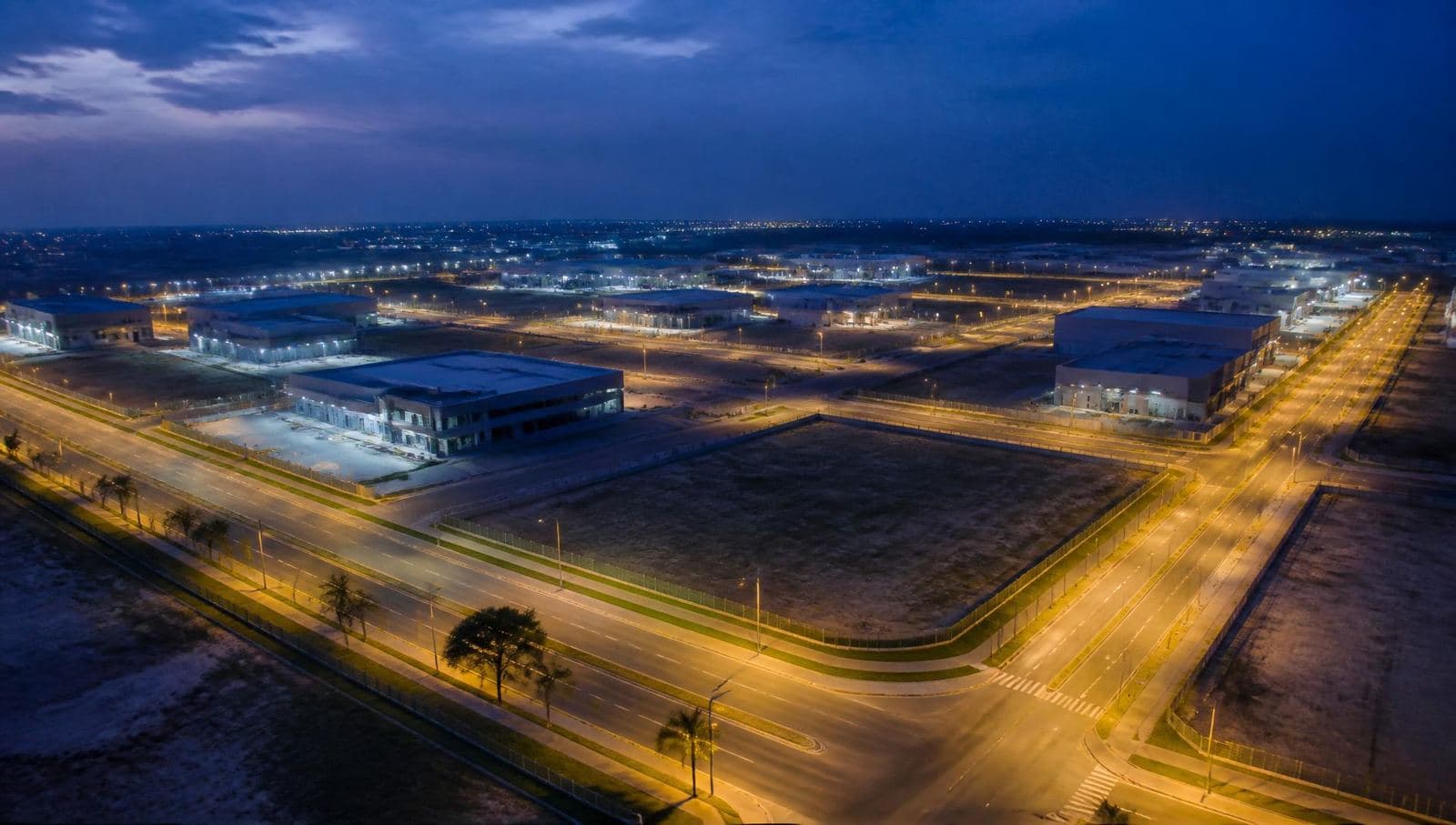 Aerial view of a planned industrial and commercial estate at dusk